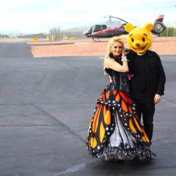 Normal life: Holly posted a photo on Instagram in July 2013 showing her on a tarmac in butterfly dress and a male companion, presumably Pasquale Rotella, in a yellow bear mask. The photo caption read: "I love my normal life!" 
